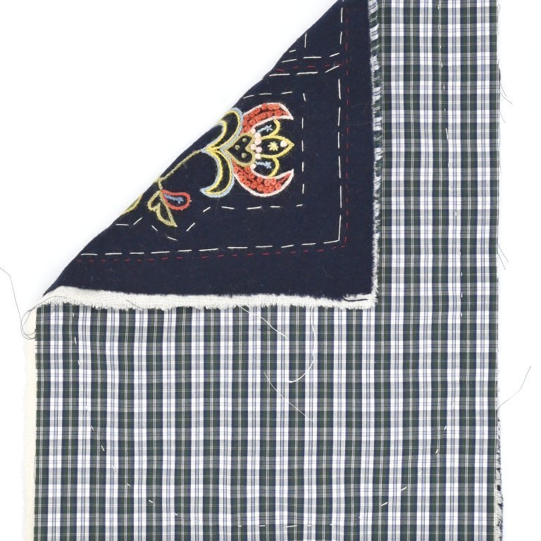 Tack the thin cotton lining to the back of the pocket front, make sure to stay within the dotted outlines of the pocket.