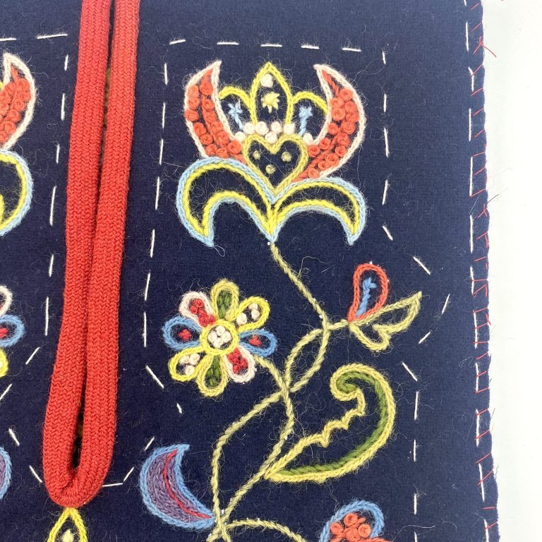 Tack together the front and back of the pocket and whip stitch the edges.