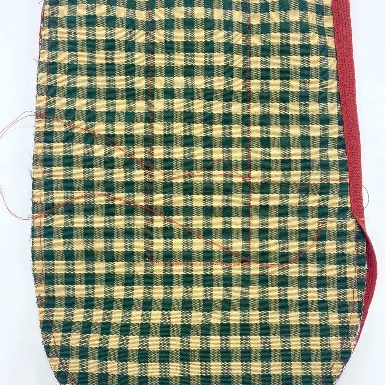 Bind the pocket, starting with the sides. Cut the binding at the top edge and secure the binding by wrapping the thread tightly around it