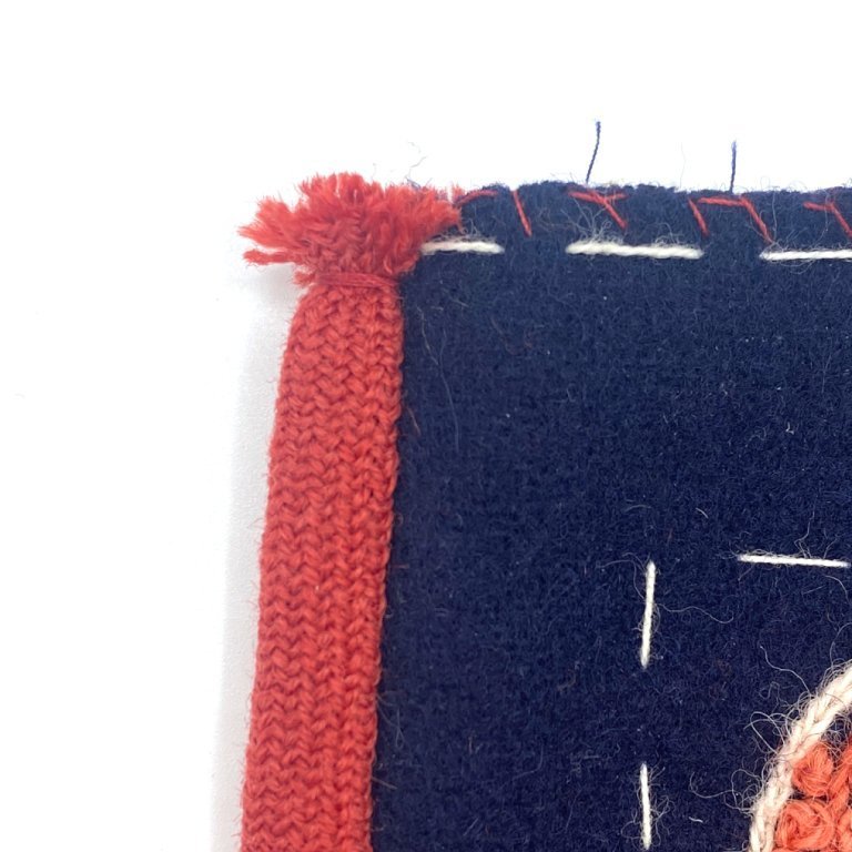 Cut the binding at the top edge and secure the binding by wrapping the thread tightly around it